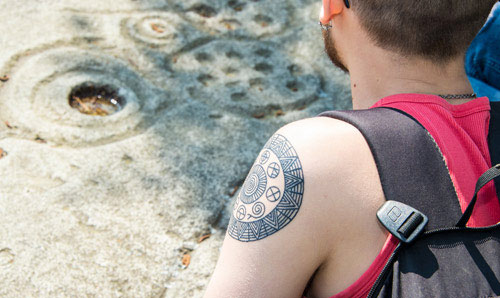 Student looking at an ancient engraving.